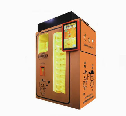 ショッピング モールの自動オレンジ ジュースのスクイーザの屋外の飲み物の自動販売機